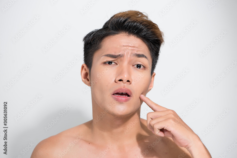 Handsome Asian man pointing his face close up portrait studio on white background