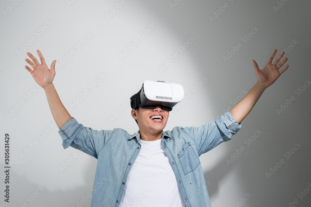 Man wearing virtual reality goggles. Studio shot, white background, isolated Man wearing virtual reality goggles. Studio shot, white background, isolated