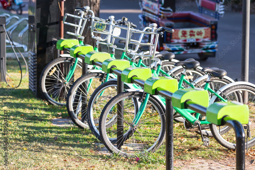 Row of city bikes for rent at docking stations