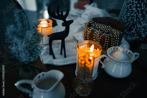 Black deer statuette, china teaspot. Christmas flat lay photo