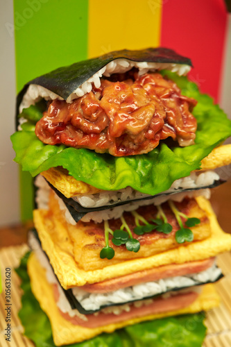 Sushi burger, rice, fried egg and seaweed 