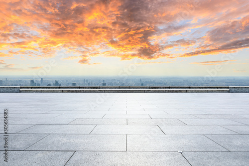 Empty floor and city skyline with beautiful clouds scenery in Shanghai at sunset.high angle view. © ABCDstock