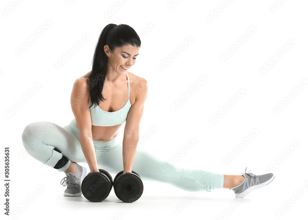 Sporty muscular woman with dumbbells isolated on white Sporty muscular woman with dumbbells isolated on white