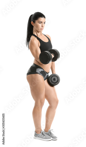 Sporty muscular woman with dumbbells isolated on white