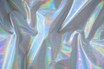 trendy holographic background.Silver metallic iridescent background.pastel colored  holographic texture in pink violet, Silver and  green colors.colorful chrome fabric.I