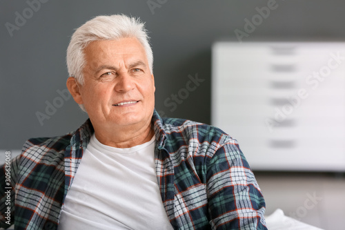 Mature man with hearing aid...