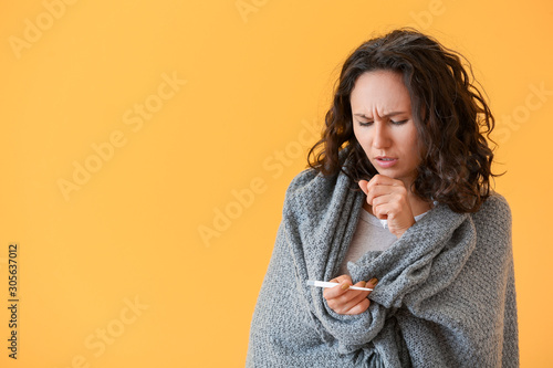Sick woman measuring temper...