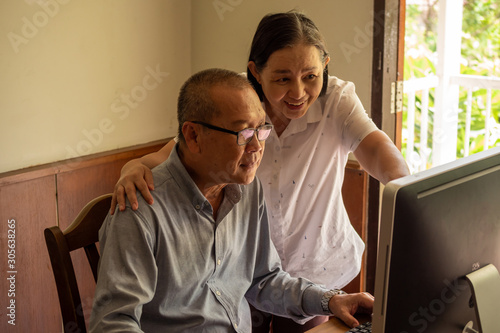 Asian woman supporting businessman at the office room. © ronnarong