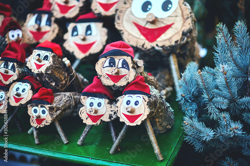 lots figures tio de nadal of close-up and blue spruce branches. Christmas character of catalonia, Christmas market in Barcelona