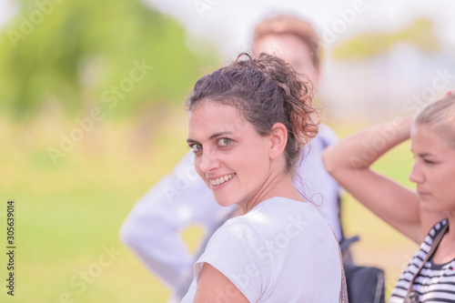 Smiling woman stares at the camera
