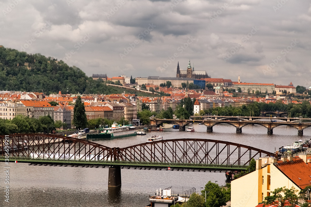 Aerial view of  Praha (Prague), Czech. Prague is colorful and beautiful European city.Beautiful view of the architecture of Prague and bridge over river Vltava in the Czech. Dramatic sky background.