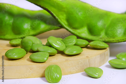 petai or bitter beans  on cutting board background photo