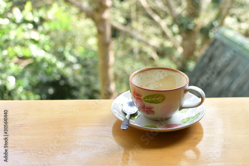 Empty coffee cup set on wood table with blur background, refreshment on morning time, relaxing in the coffee shop.