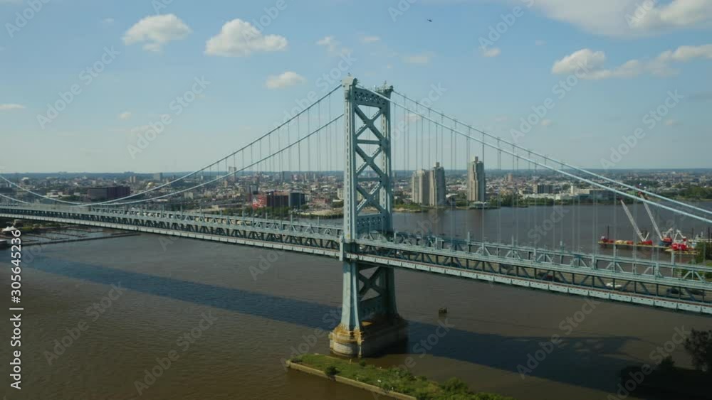 Aerial - Pan left as vehicles cross over Ben Franklin Bridge in Philadelphia, Pennsylvania Aerial - Pan left as vehicles cross over Ben Franklin Bridge in Philadelphia, Pennsylvania