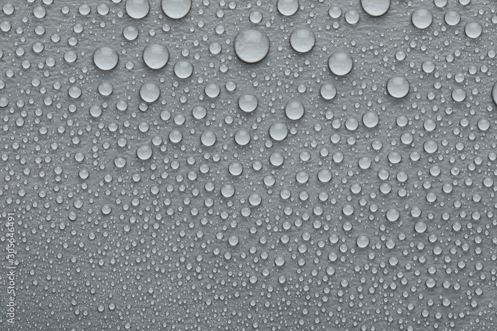 Water drops on grey background, top view Water drops on grey background, top view