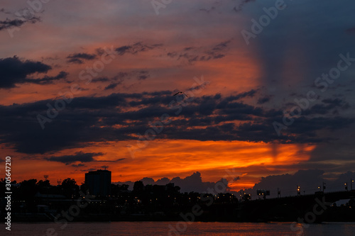 Colorful sky with clouds at sunset over Irkutsk city and Angara river with bridge
