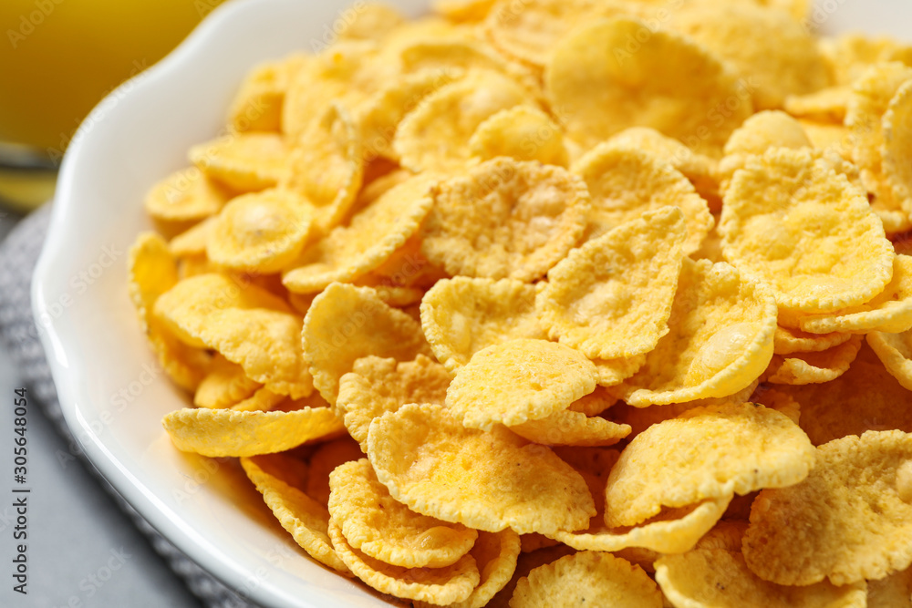 Tasty crispy corn flakes in bowl, closeup Tasty crispy corn flakes in bowl, closeup