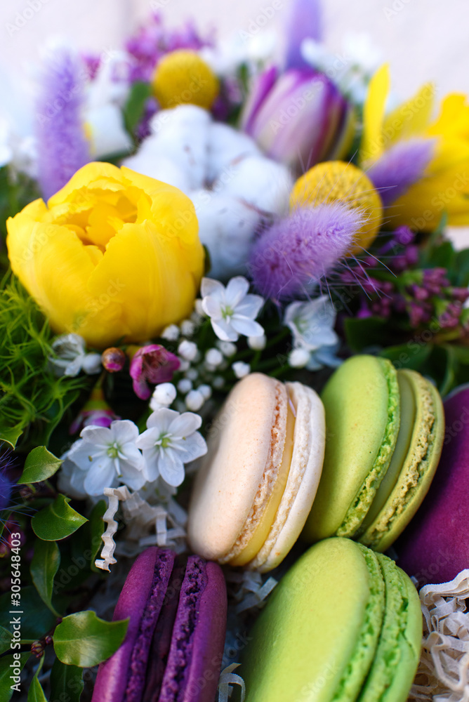 Flowers and colorful macaroons cakes as a gift Flowers and colorful macaroons cakes as a gift