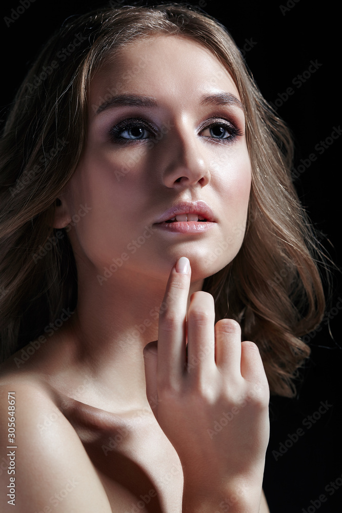 Female with wavy hair on black background Female with wavy hair on black background