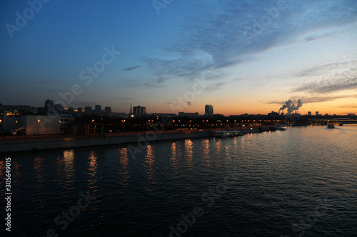 sunset on the river in the city