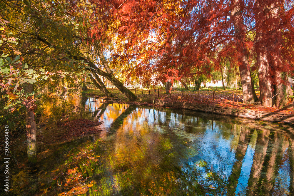 Autumn landscape with wonderful foliage over river Clitunno in Umbria Autumn landscape with wonderful foliage over river Clitunno in Umbria
