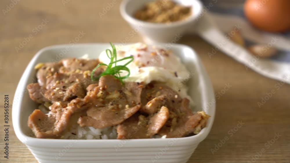 stir-fried pork with garlic on topped rice with egg - asian food style stir-fried pork with garlic on topped rice with egg - asian food style