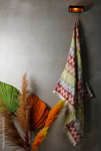 Bath towel standing on wall. Turkish bath loincloth. Peshtemal. photo