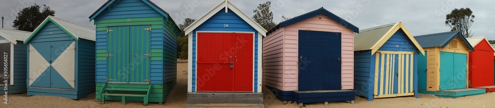 views of rows of colourful beach bright painted summer holiday bathing box's along a sandy beach on a sunny day, Brighton beach, Melbourne Victoria - obrazy, fototapety, plakaty 