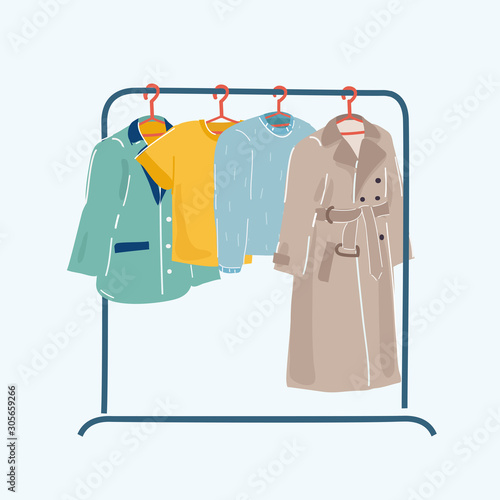 Clothes or apparel hanging on hangers on rack