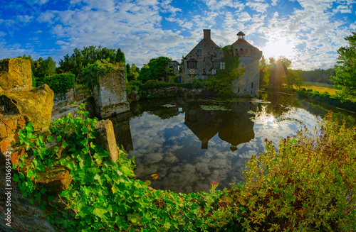 Sunrise at the castle ruin Scotney Castle in southern England.