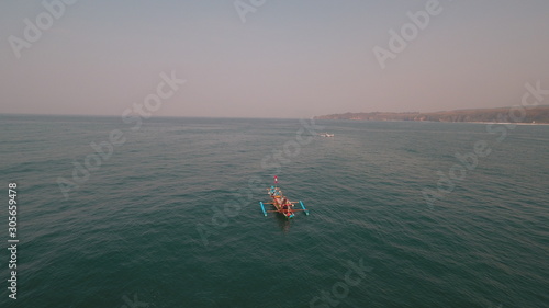 small boat and vast ocean © adnan