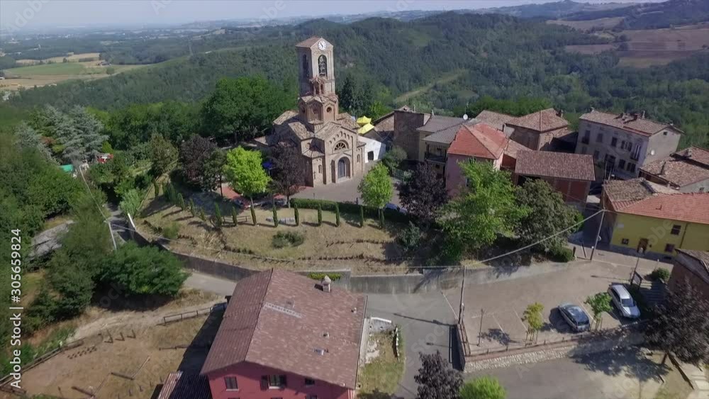 4k aerial drone backward flight footage to the ancien church and the small village of Gavazzana, near  Tortona, Alessandria Province, Italy.