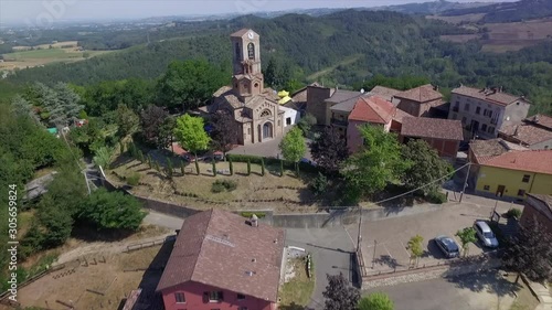 4k aerial drone backward flight footage to the ancien church and the small village of Gavazzana, near  Tortona, Alessandria Province, Italy.