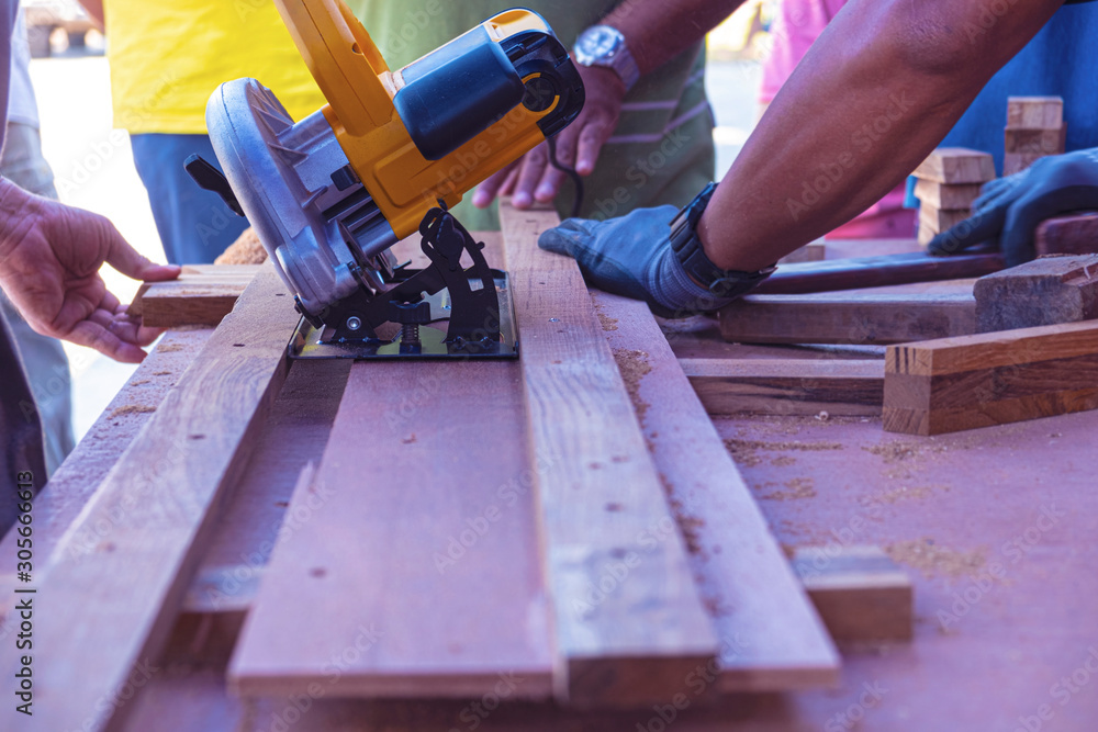 Blurred for background.Cutting wood hand power saw. Blurred for background.Cutting wood hand power saw.