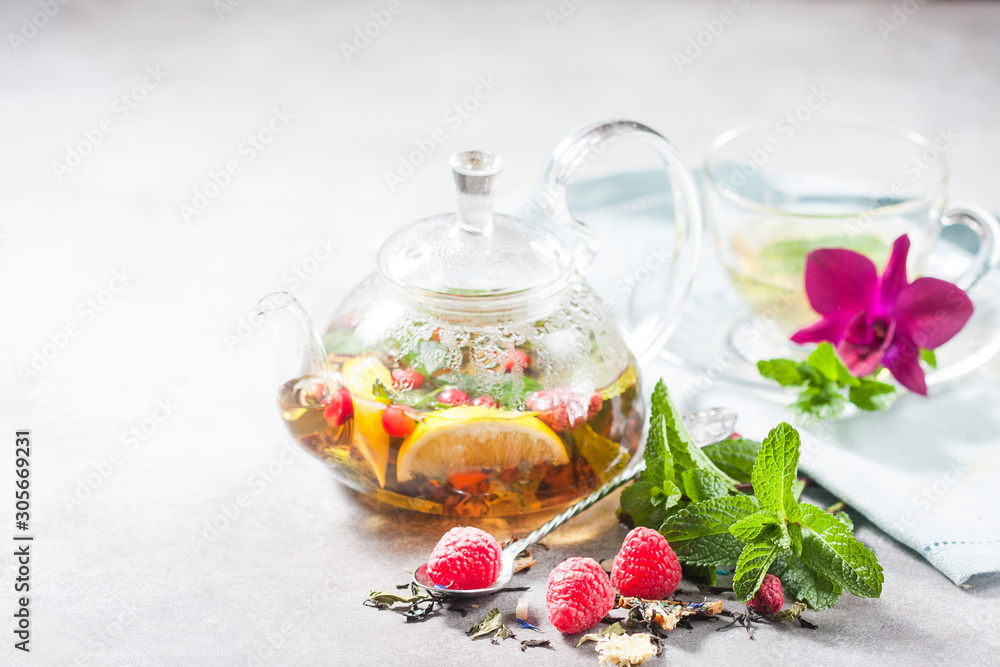 Hot herbal tea with lemon, raspberries and mint. Healthy lemon tea. Hot herbal tea with lemon, raspberries and mint. Healthy lemon tea.