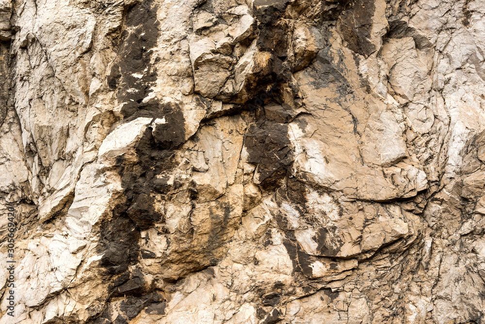 Texture of natural layered limestone surface rock, quarry limestone, limestone hill Texture of natural layered limestone surface rock, quarry limestone, limestone hill