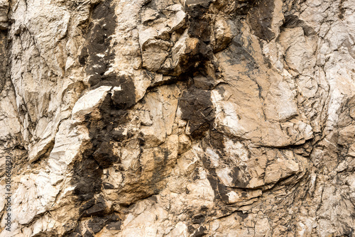 Texture of natural layered limestone surface rock, quarry limestone, limestone hill