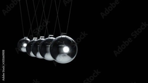 loop, cause and effect, a swinging Newton?s Cradle in slow motion, silver metal, with depth of field on a black background, 4k photo