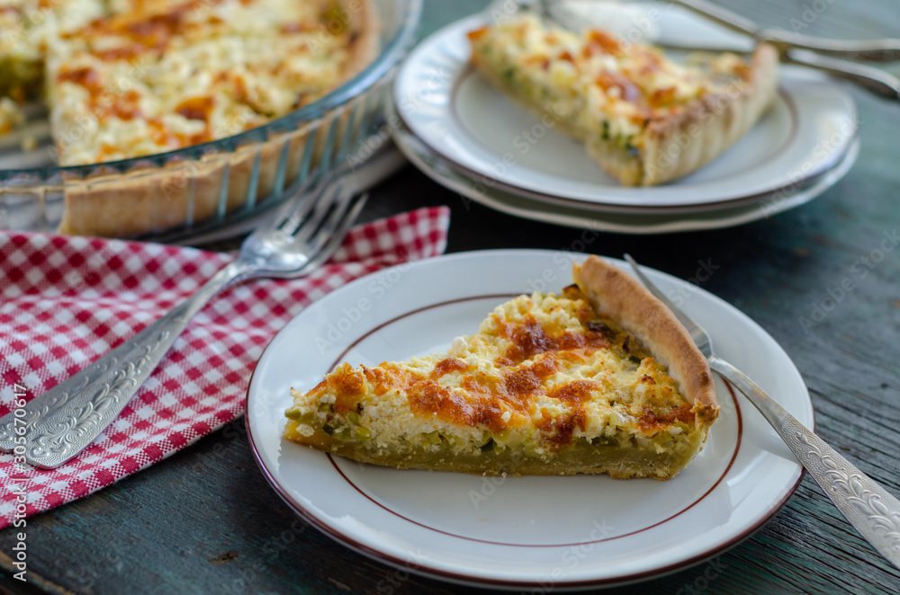 Slice of filled pie with leek and cheese