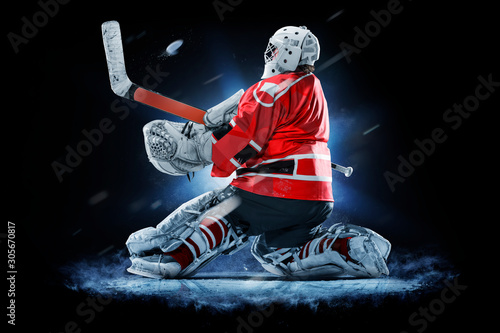 Canvas Print Professional ice hockey goalkeeper or goalie or goaltender isolated on black bac