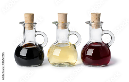 Glass bottles with different types of vinegar photo