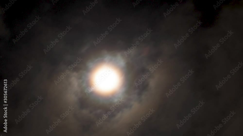 Full real moon behind clouds at night, falling down. Timelapse. Full real moon behind clouds at night, falling down. Timelapse.