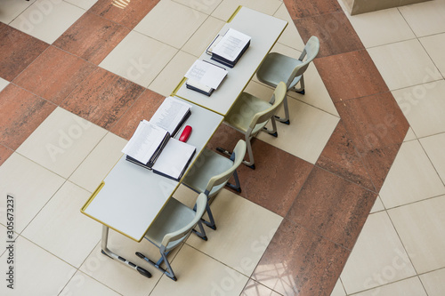 table with papers and diplomas. white papers and documents on wooden tables.