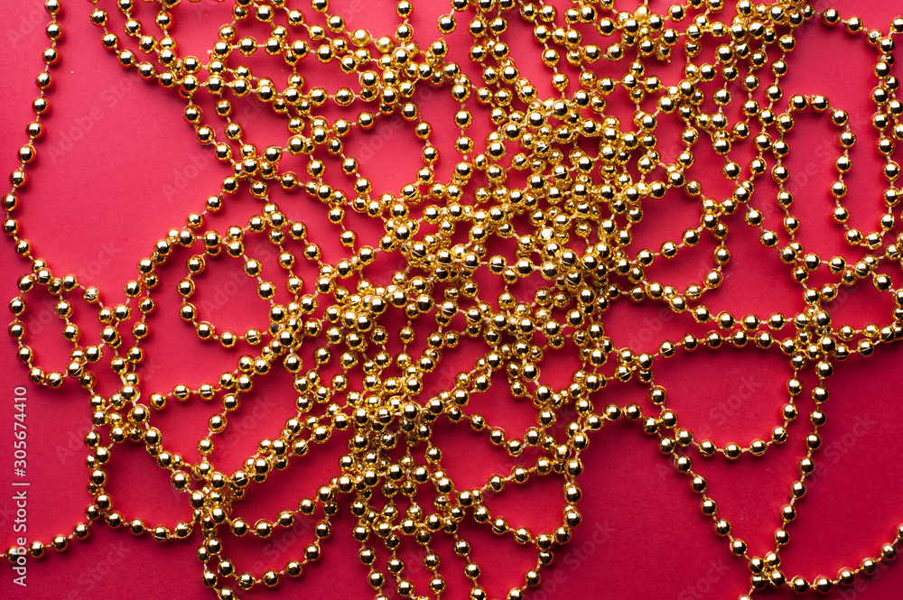 Golden beads on Red Background