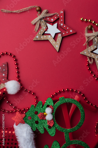 Christmas Headband, Funny Glasses With Green Trees and Wooden Toys on Red Background.