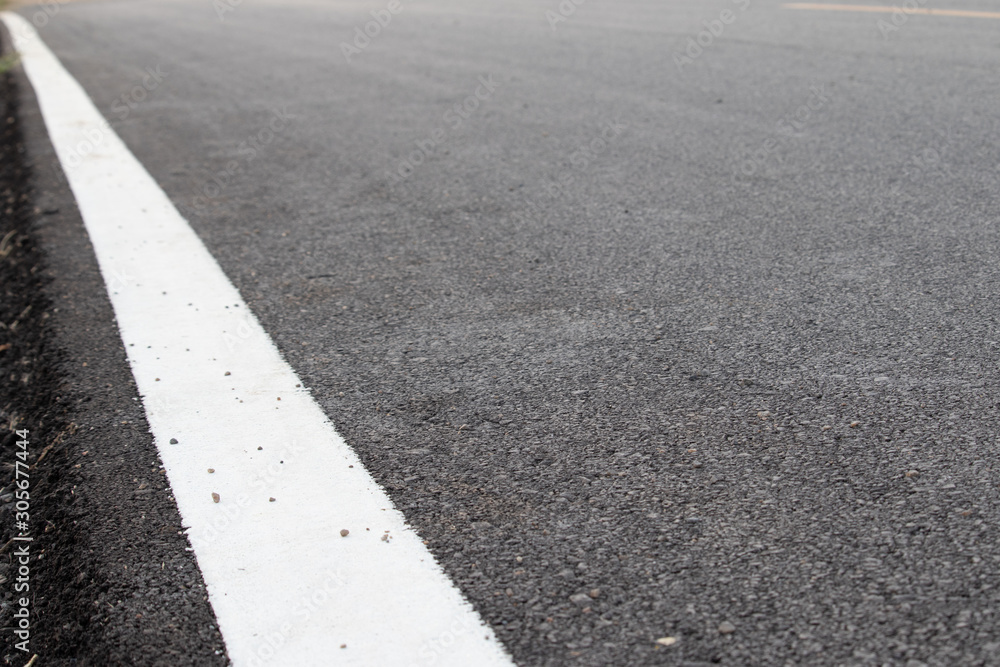 asphalt road with white edge line asphalt road with white edge line