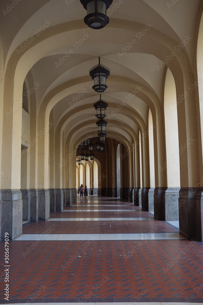 Obraz premium corridor arcade with lamp Salerno, Italy, italian architecture