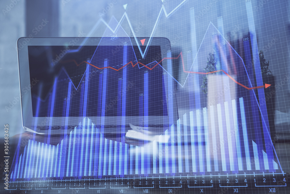 Financial chart drawing and table with computer on background. Multi exposure. Concept of international markets. Financial chart drawing and table with computer on background. Multi exposure. Concept of international markets.