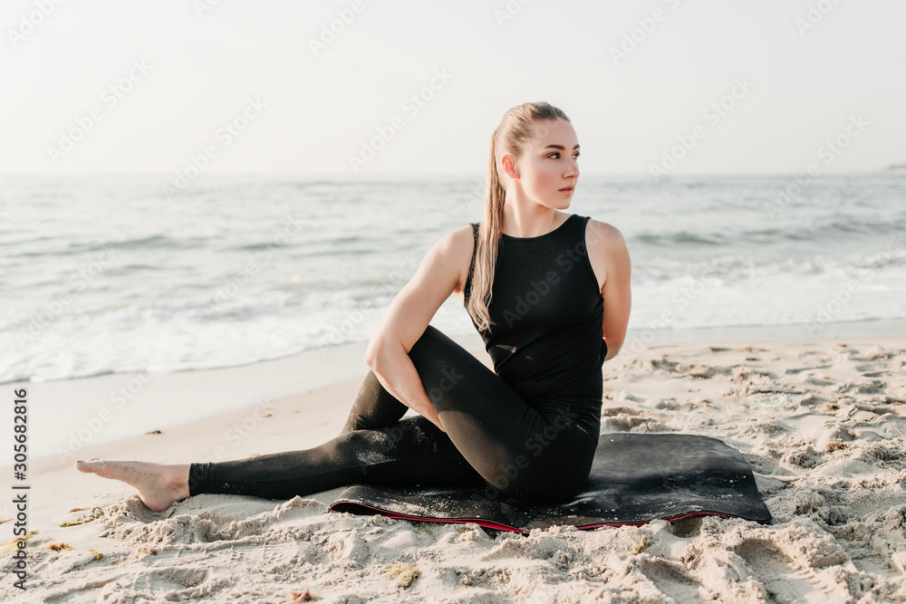 beautiful sporty woman doing yoga on the beach near ocean beautiful sporty woman doing yoga on the beach near ocean