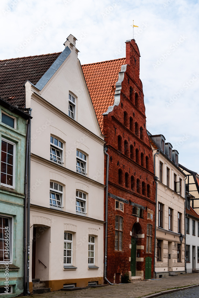 Street view of old gable houses in the old city centre of Wismar. Germany